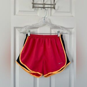 Nike Women's Athletic Shorts in Reddish-Orange with Black and Yellow Trim
